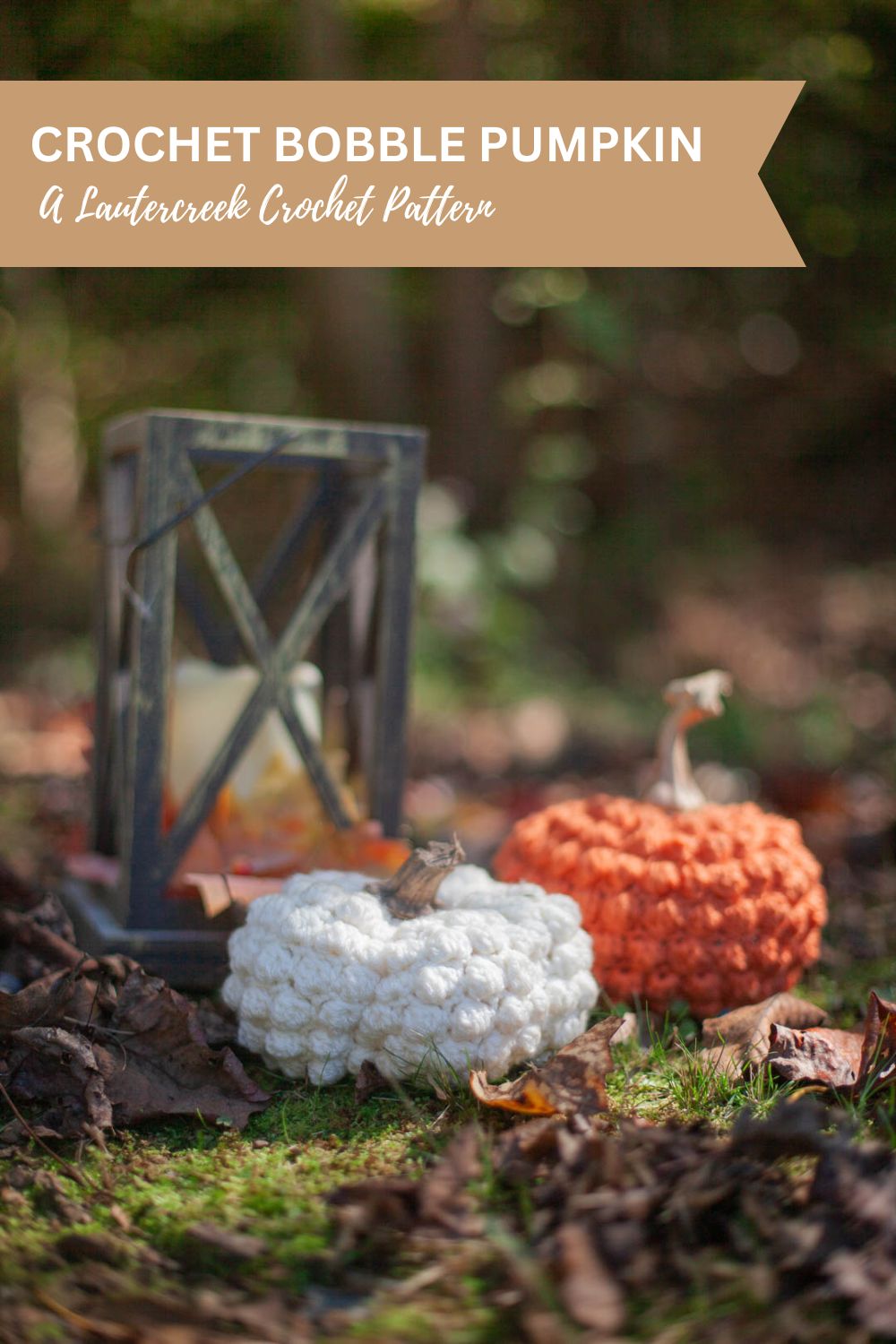 Two crochet pumpkins sitting in front of a wooden candle with a banner above reading 'Crochet Bobble Pumpkin, A Lautercreek Crochet Pattern'.