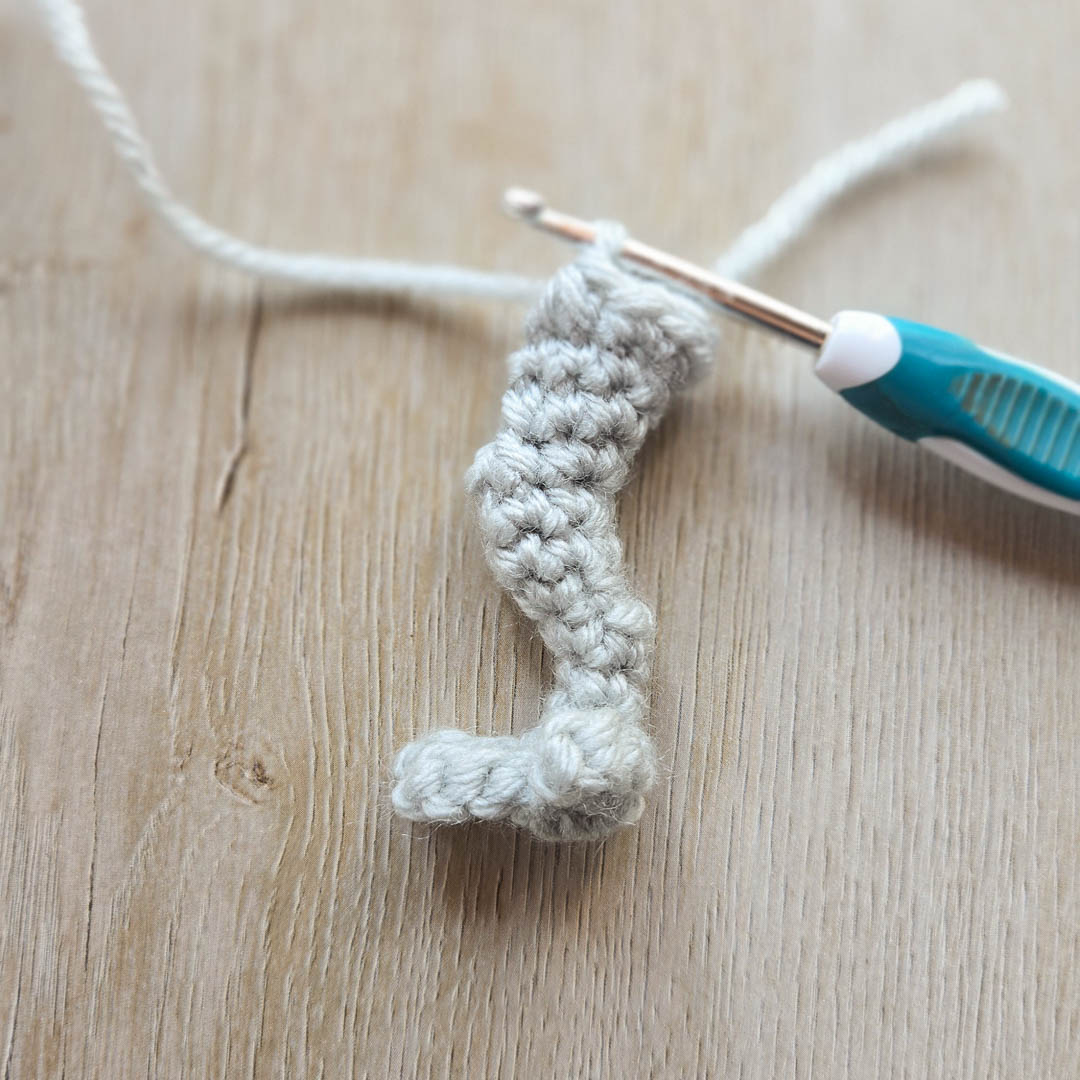 A dinosaur leg made with crochet.