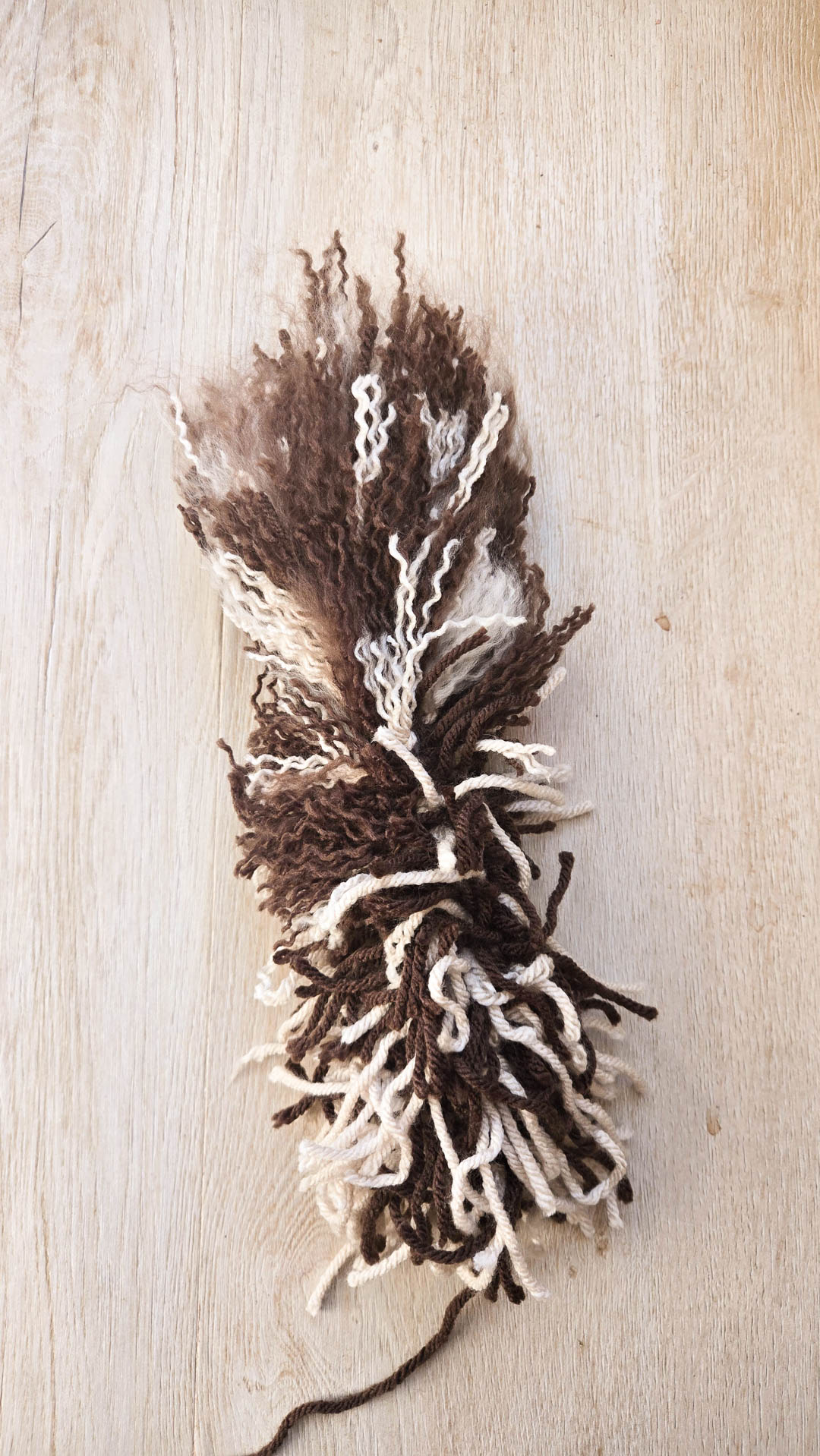 A crochet project half covered with realistic looking crochet fur.